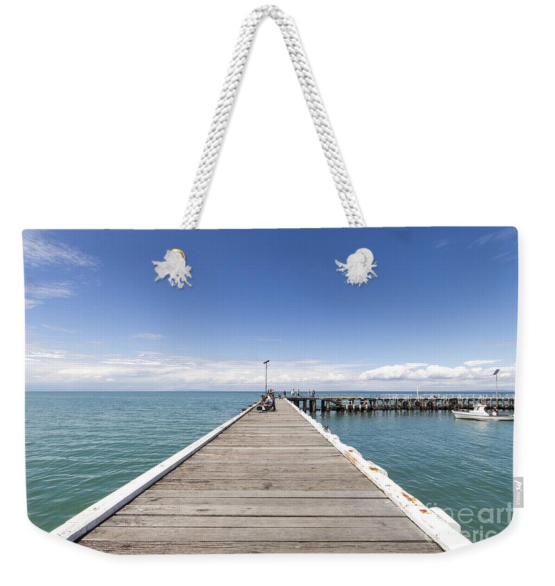 Pier Weekender Tote Bag featuring the photograph A great day for fishing by Linda Lees