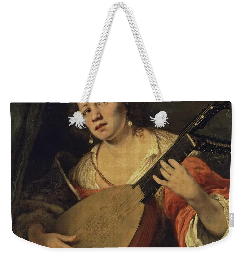 Ferdinand Bol Weekender Tote Bag featuring the painting A Lady Playing the Lute by Ferdinand Bol