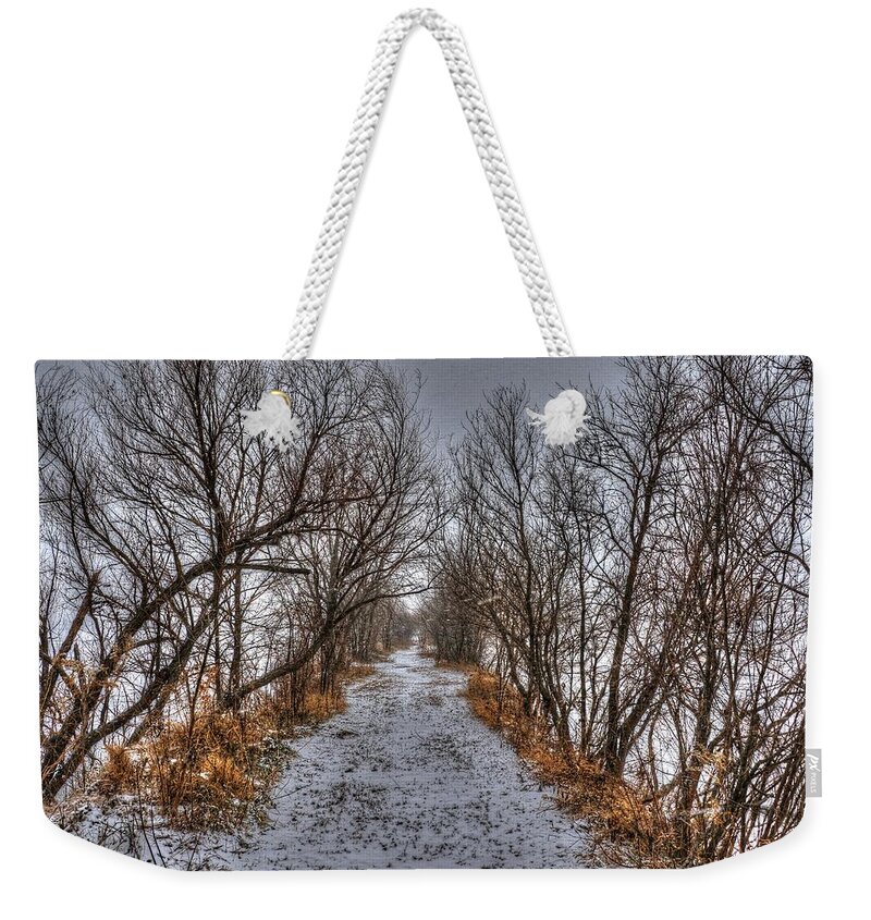 Snowy Weekender Tote Bag featuring the photograph A Path Less Traveled by J Laughlin