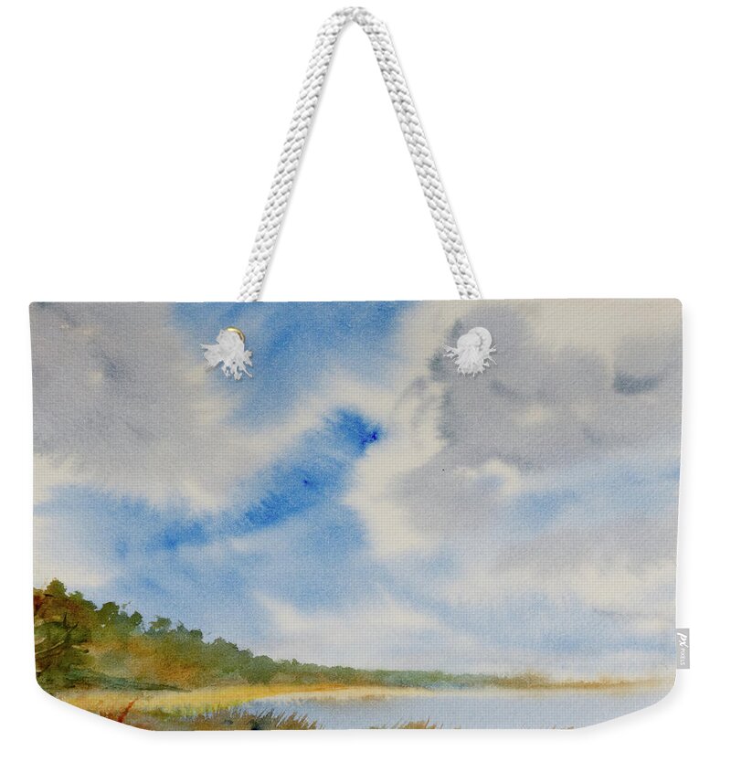 Beach Weekender Tote Bag featuring the painting A secluded Inlet beneath billowing clouds by Dorothy Darden