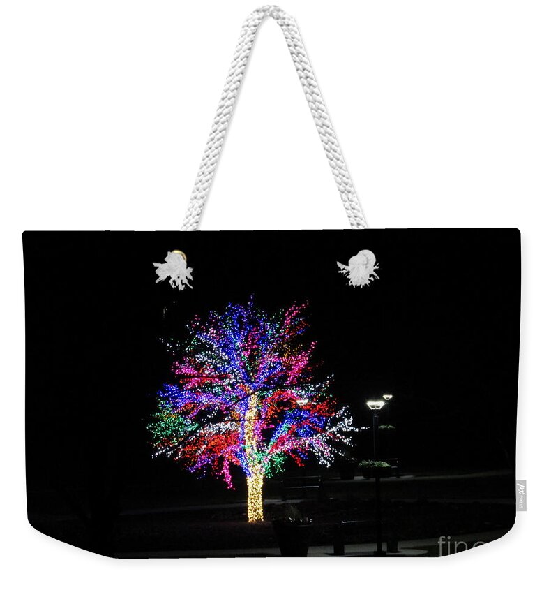  Weekender Tote Bag featuring the photograph A Shot In The Dark by Kelly Awad