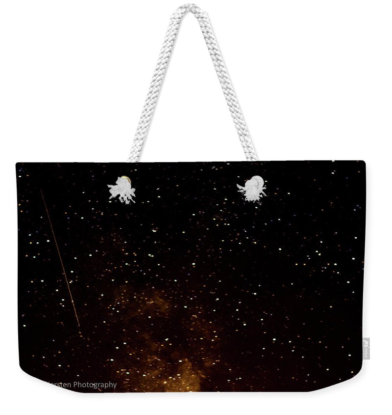 Dark Weekender Tote Bag featuring the photograph A star is fallen by Rainer Kersten