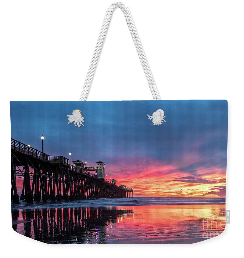 Beach Weekender Tote Bag featuring the photograph A Stunning Sunset in Oceanside by David Levin