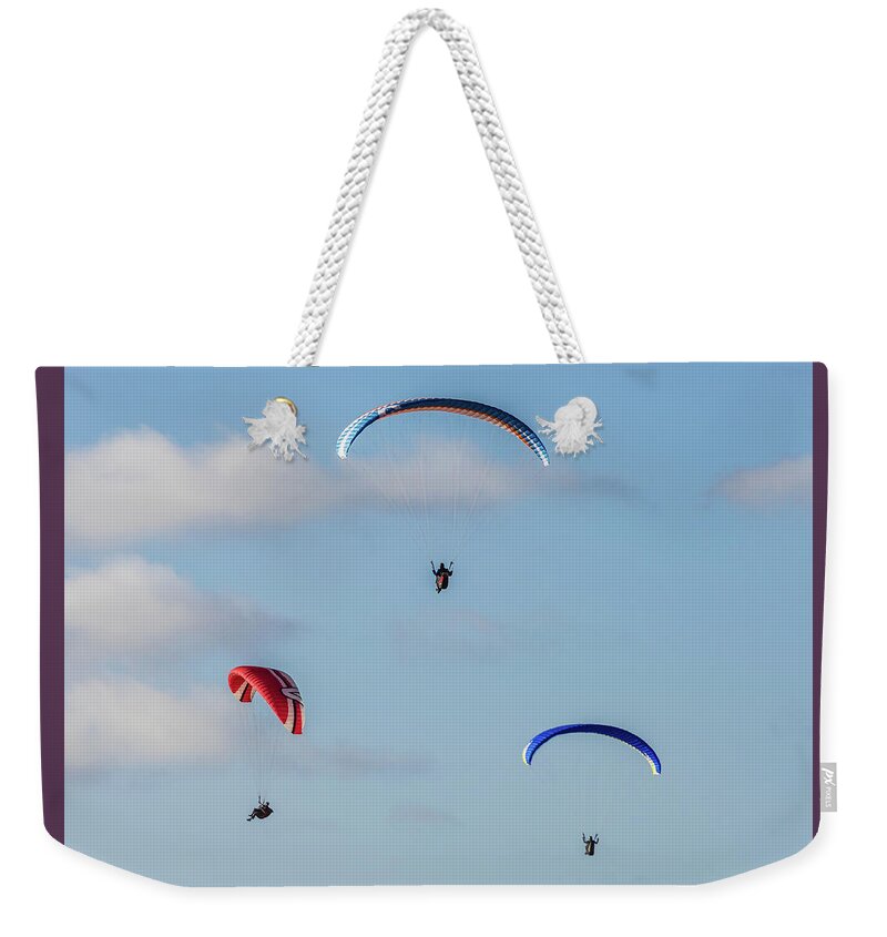Beach Weekender Tote Bag featuring the photograph A Trio of Paragliders at Torrey Pines Gliderport by David Levin