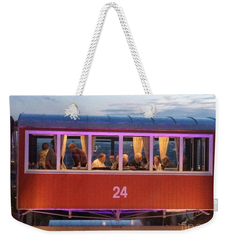 Wagon Weekender Tote Bag featuring the photograph A Wagon In The Sky by Donato Iannuzzi