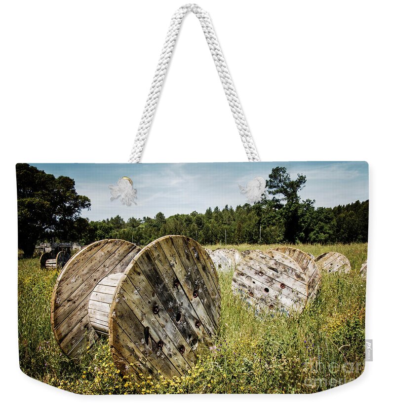 Cable Weekender Tote Bag featuring the photograph Abandoned Cable Reels by Carlos Caetano