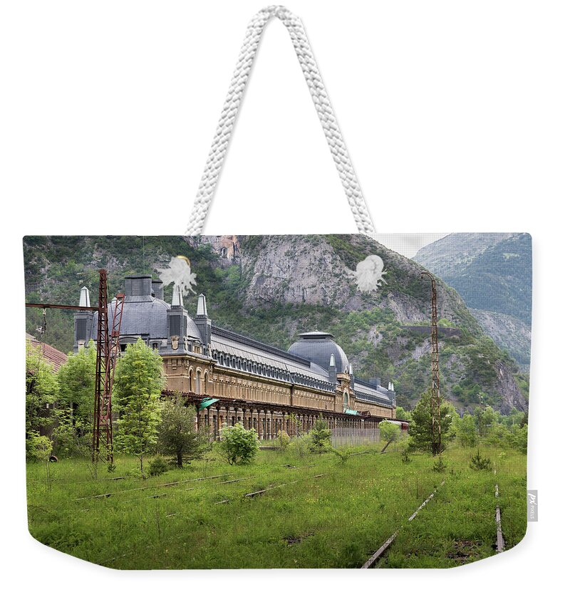 Canfranc Weekender Tote Bag featuring the photograph Abandoned side of the Canfranc international railway station by RicardMN Photography