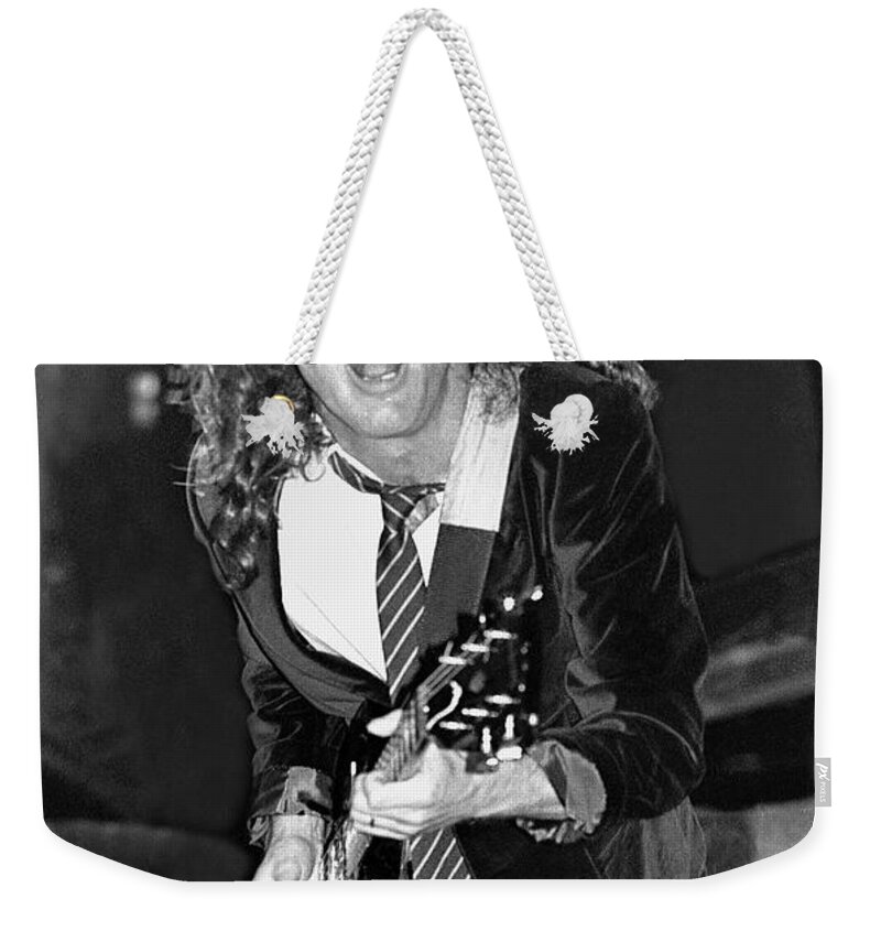 Rock Weekender Tote Bag featuring the photograph Ac Dc - Angus Young by Concert Photos