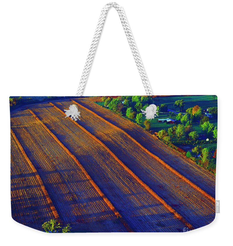 Aerial Weekender Tote Bag featuring the photograph Aerial Farm field harvested at sunset by Tom Jelen