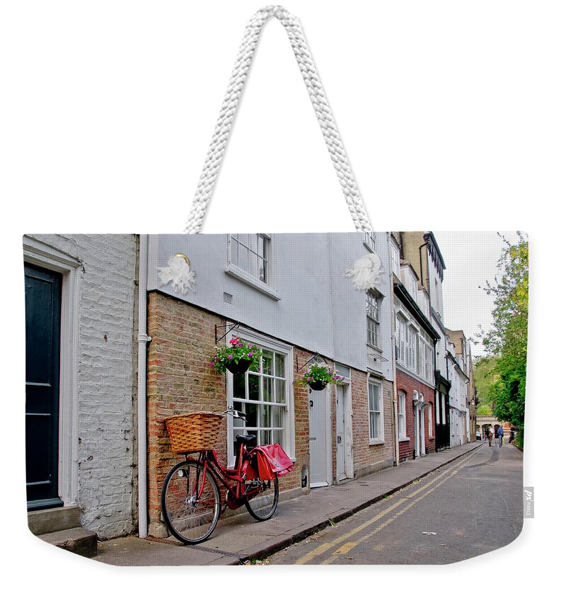 Cambridge Weekender Tote Bag featuring the photograph Afternoon with a bike. by Elena Perelman