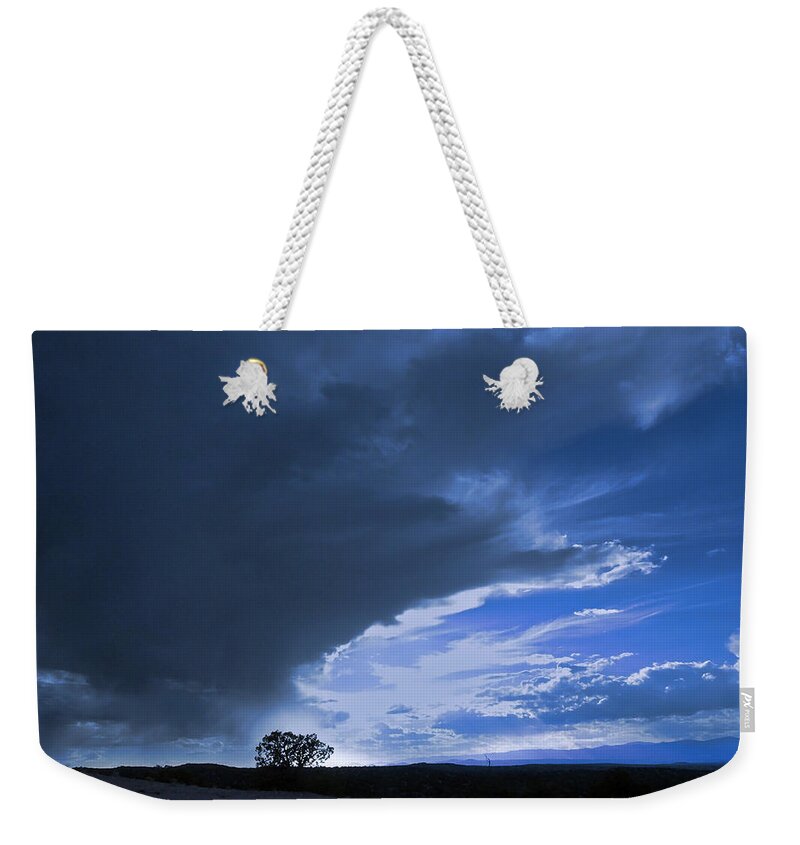 Sky Weekender Tote Bag featuring the photograph Alone by John Hansen