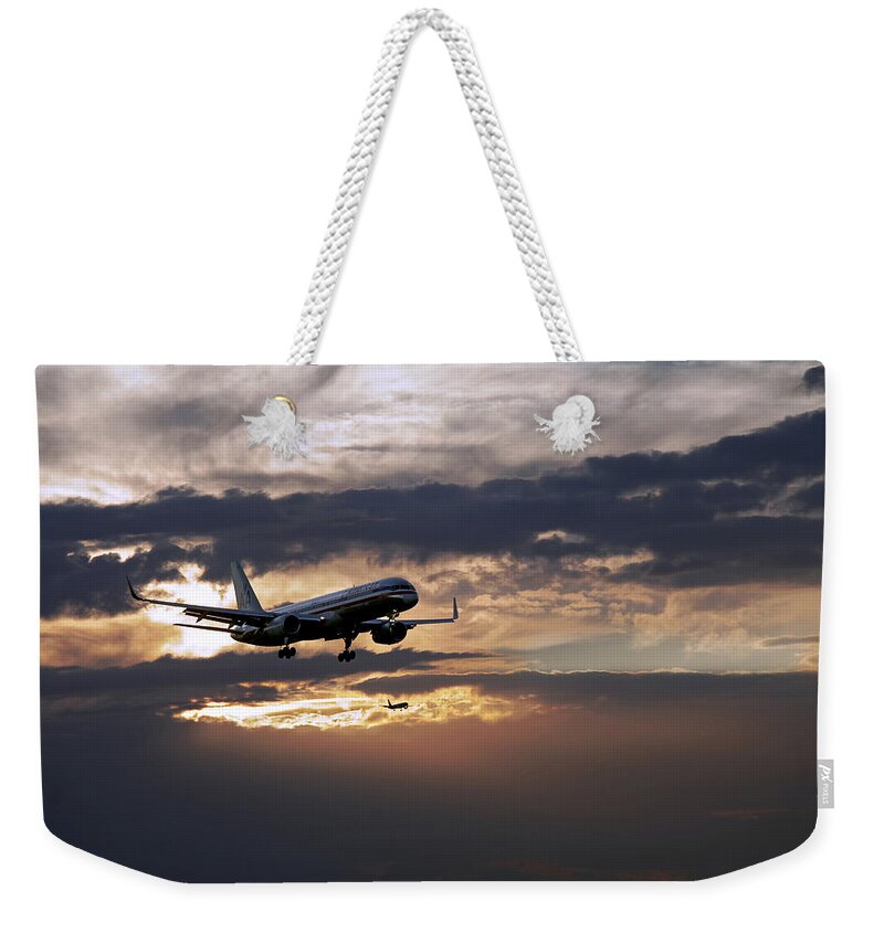Aa Aircraft Landing Weekender Tote Bag featuring the photograph American aircraft landing at the twilight. Miami. FL. USA by Juan Carlos Ferro Duque