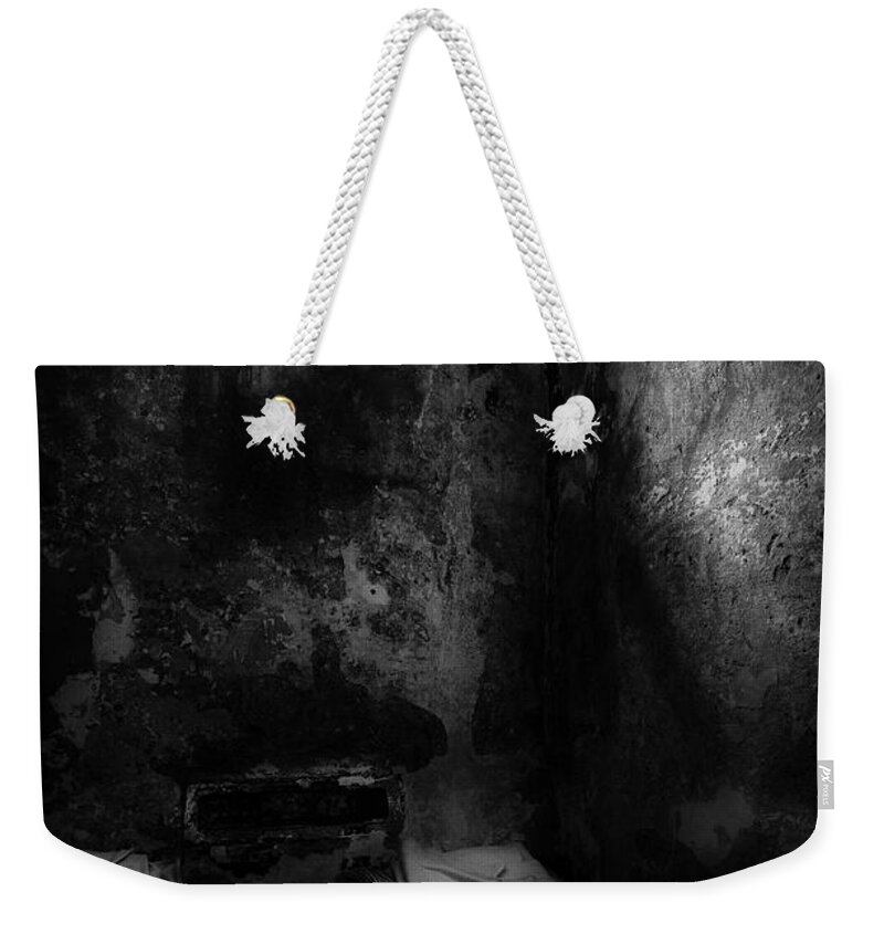 Ireland Weekender Tote Bag featuring the photograph An empty cell in old Cork City Gaol by RicardMN Photography