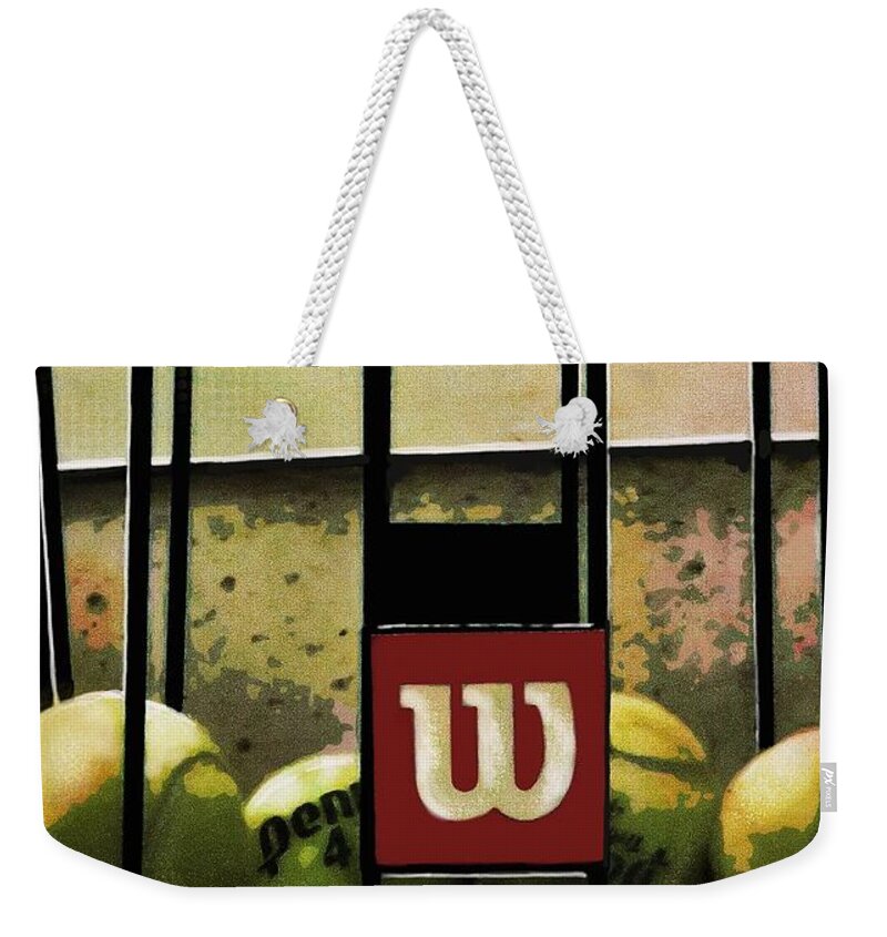 Tennis Balls Weekender Tote Bag featuring the photograph An Escapee by Diana Rajala