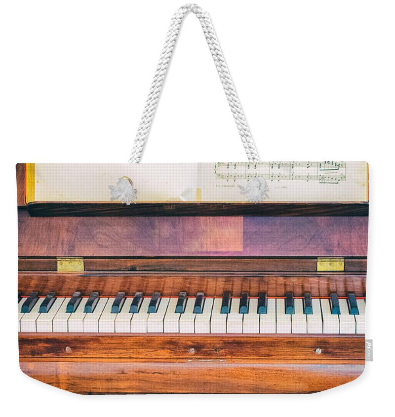 Antique Weekender Tote Bag featuring the photograph Antique piano and music sheet by Silvia Ganora