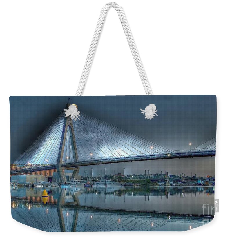 Australian Weekender Tote Bag featuring the photograph  Anzac Bridge by Moonlight. by Geoff Childs