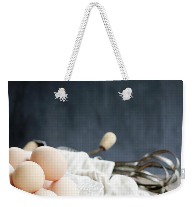 Eggs Weekender Tote Bag featuring the photograph Apron and Brown Eggs by Stephanie Frey