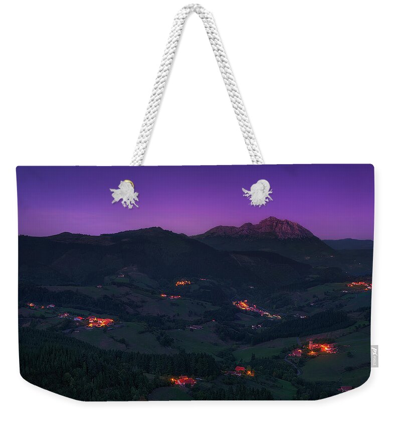 Mountain Weekender Tote Bag featuring the photograph Aramaio valley at night by Mikel Martinez de Osaba