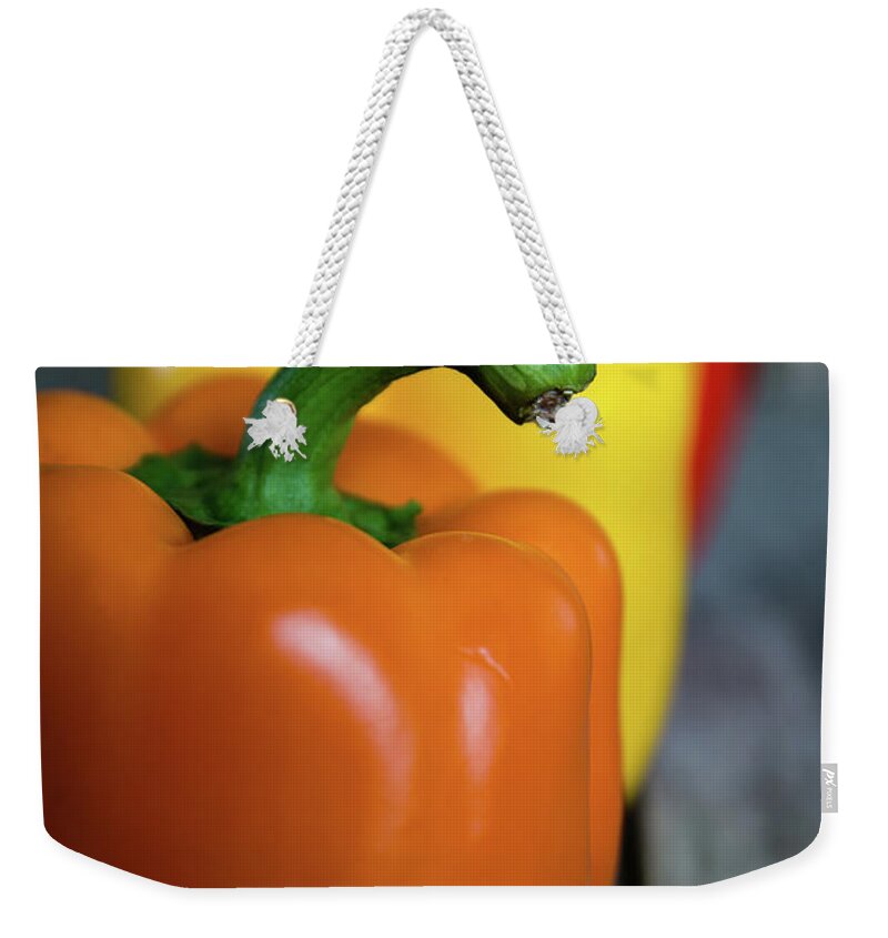 Green Weekender Tote Bag featuring the photograph Array of Peppers by Deborah Klubertanz