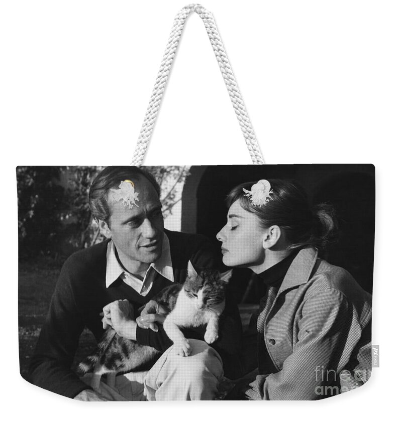 B&w Weekender Tote Bag featuring the photograph Audrey Hepburn and Mel Ferrer by George Daniell
