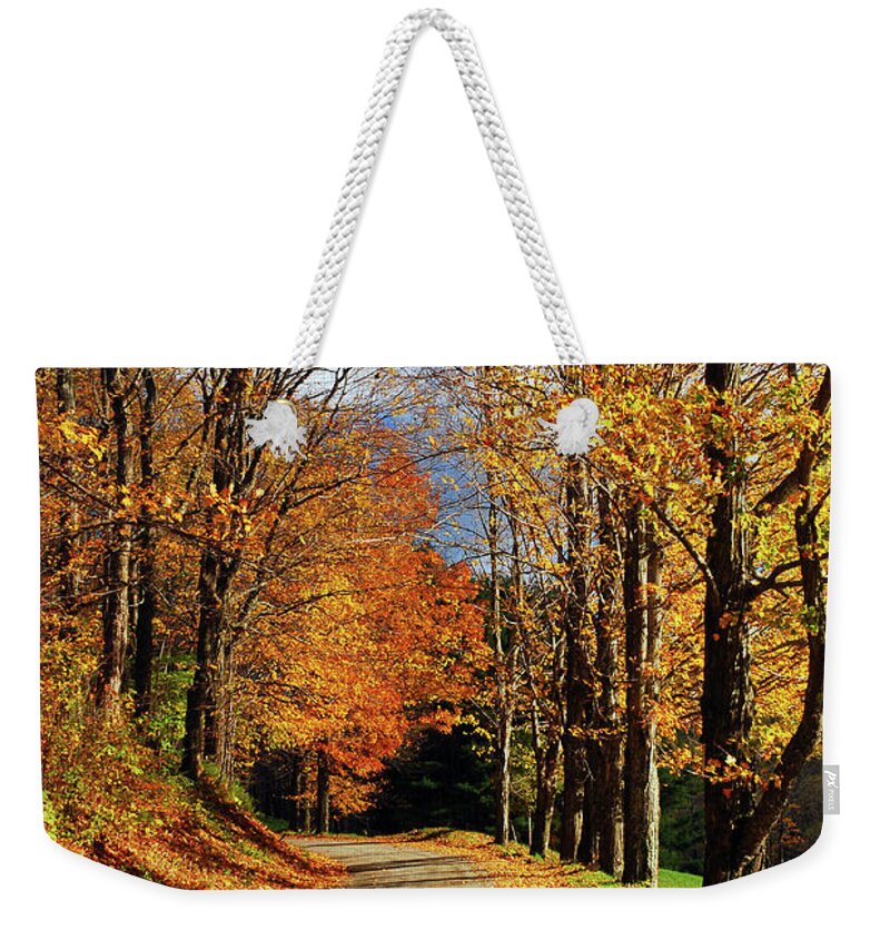 Woodstock Weekender Tote Bag featuring the photograph Autumn Country Road by James Kirkikis