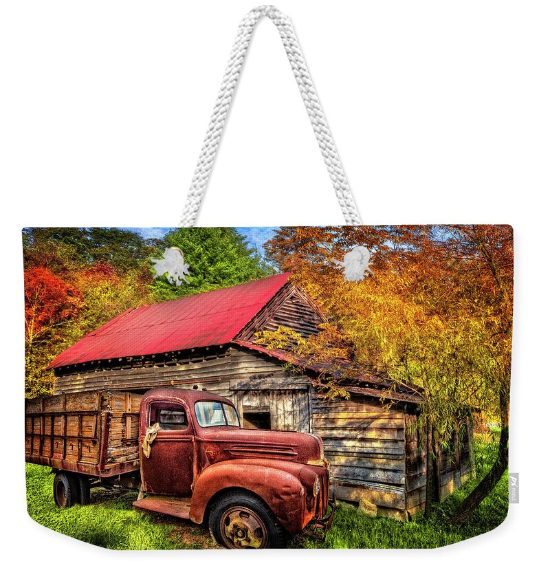 1940s Weekender Tote Bag featuring the photograph Autumn Shades of Red and Gold by Debra and Dave Vanderlaan