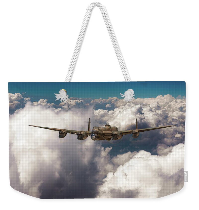 Item Weekender Tote Bag featuring the photograph Avro Lancaster above clouds by Gary Eason