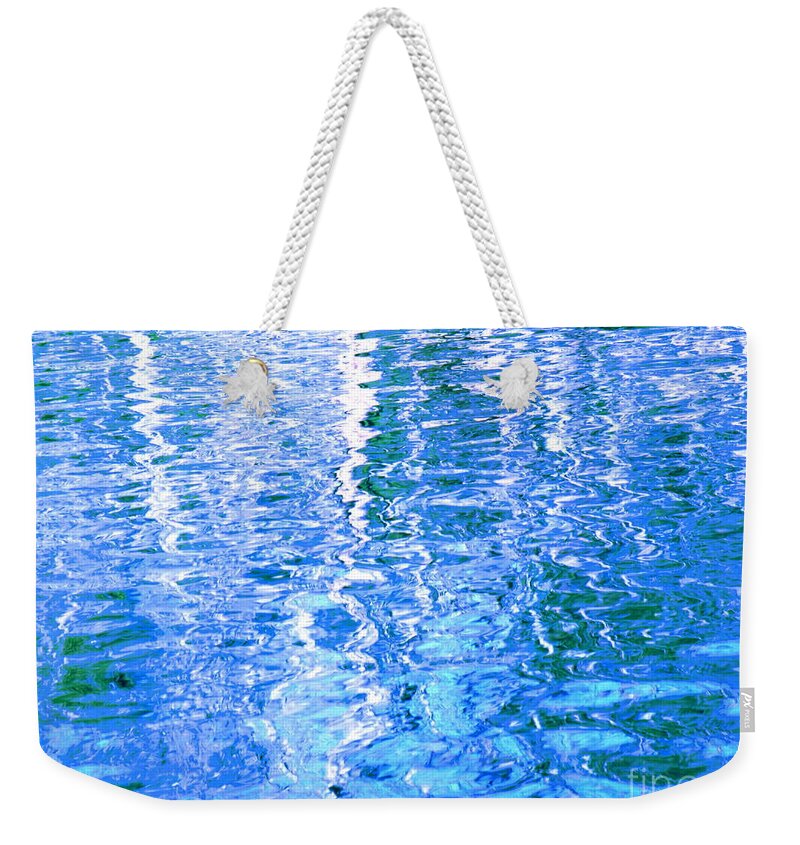 Water Weekender Tote Bag featuring the photograph Baffling Blue Water by Sybil Staples