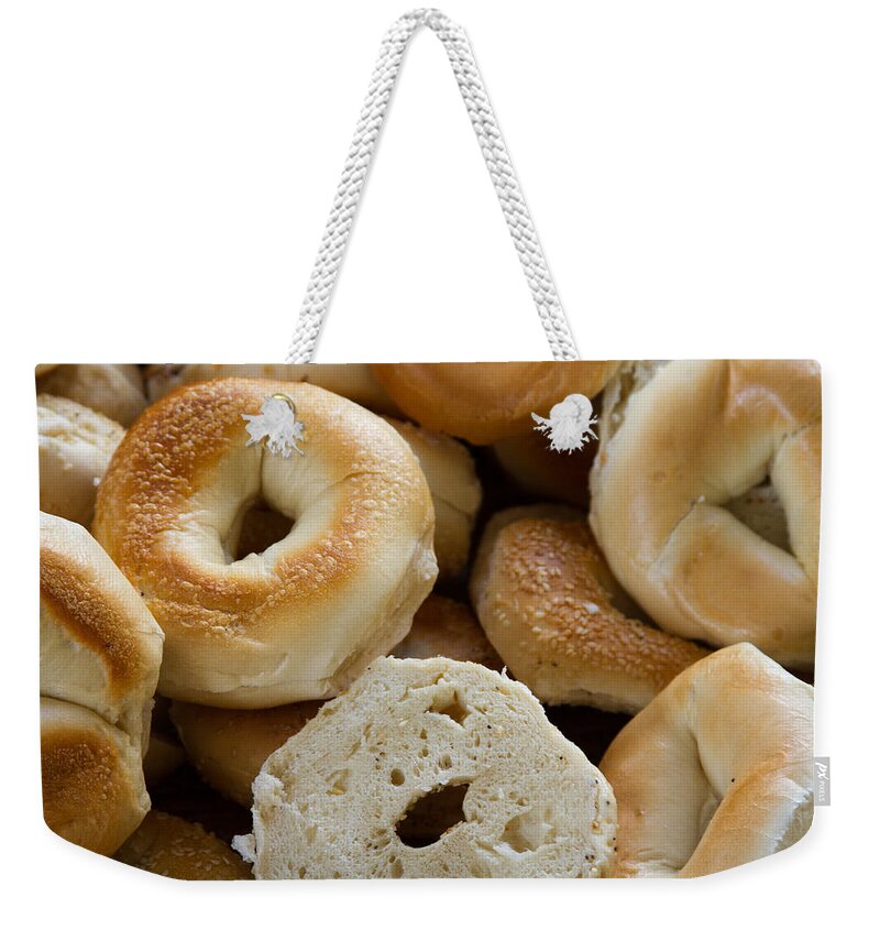 Food Weekender Tote Bag featuring the photograph Bagels 1 by Michael Fryd