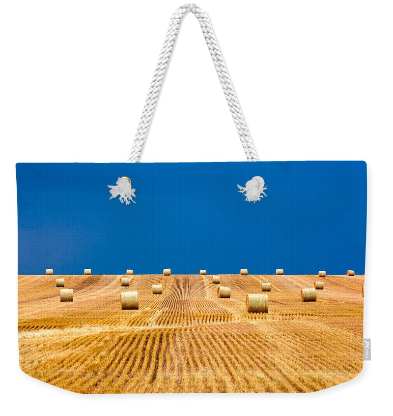 Field Weekender Tote Bag featuring the photograph Bales on the Storm by Todd Klassy