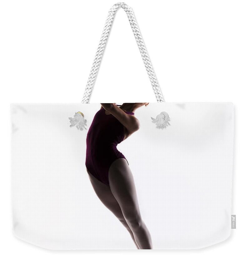 Ballet Weekender Tote Bag featuring the photograph Ballerina jump by Steve Williams