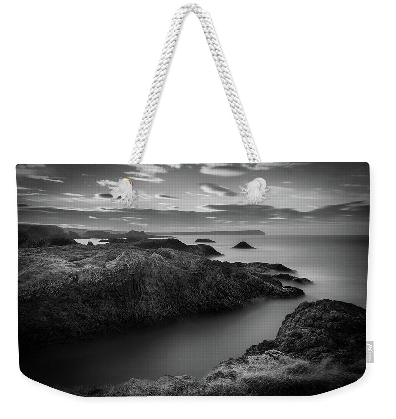 Ballintoy Weekender Tote Bag featuring the photograph Ballintoy Rugged Coast by Nigel R Bell