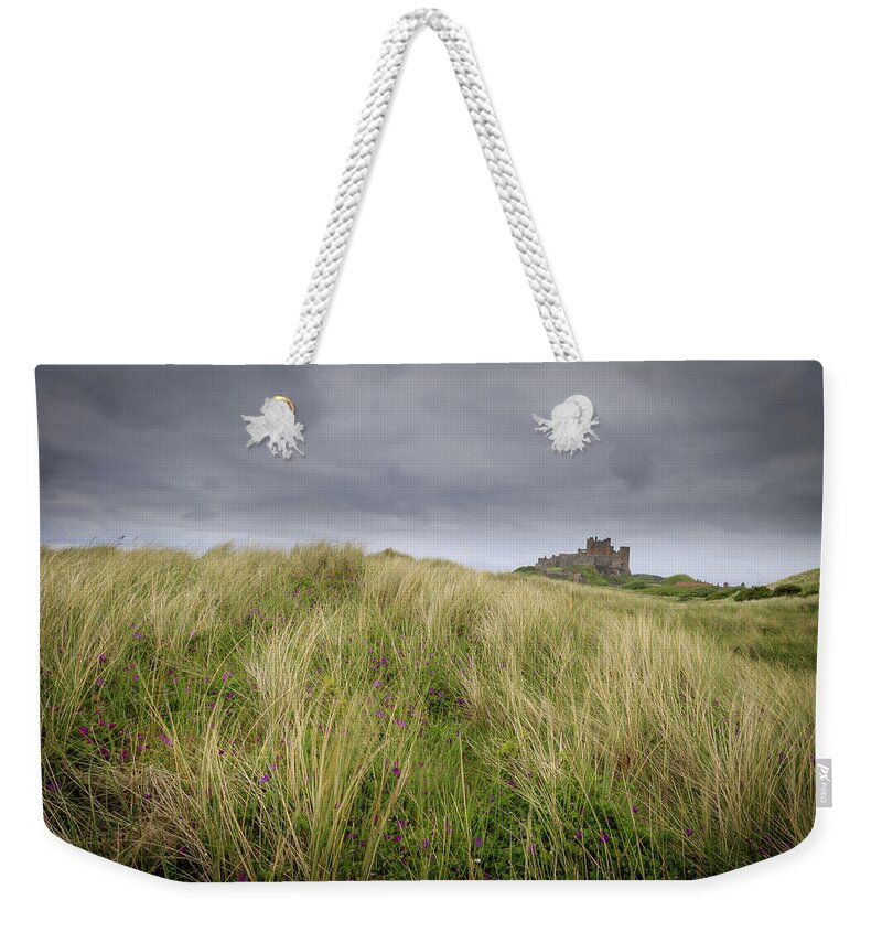 Sand Weekender Tote Bag featuring the photograph Bamburgh Castle - 2 by Chris Smith
