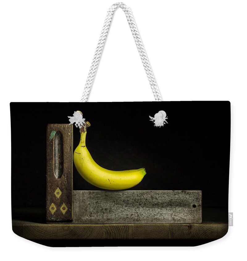 Banana Weekender Tote Bag featuring the photograph Bananas ain't square by Nigel R Bell