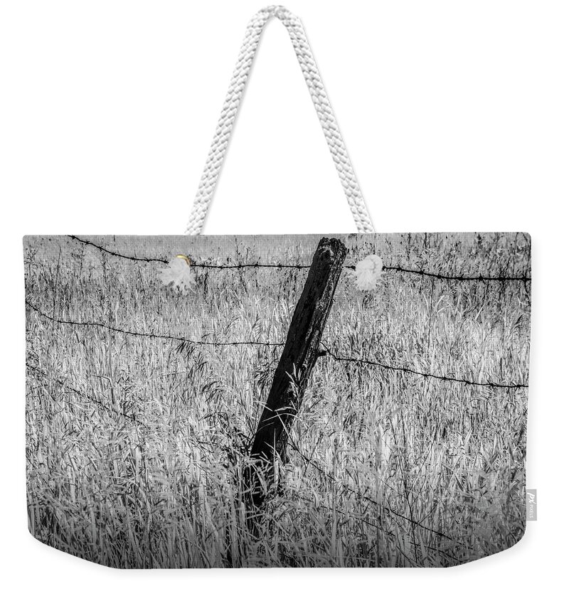 Fence Weekender Tote Bag featuring the photograph Barb Wire Fence in Infrared Blackand White by Randall Nyhof