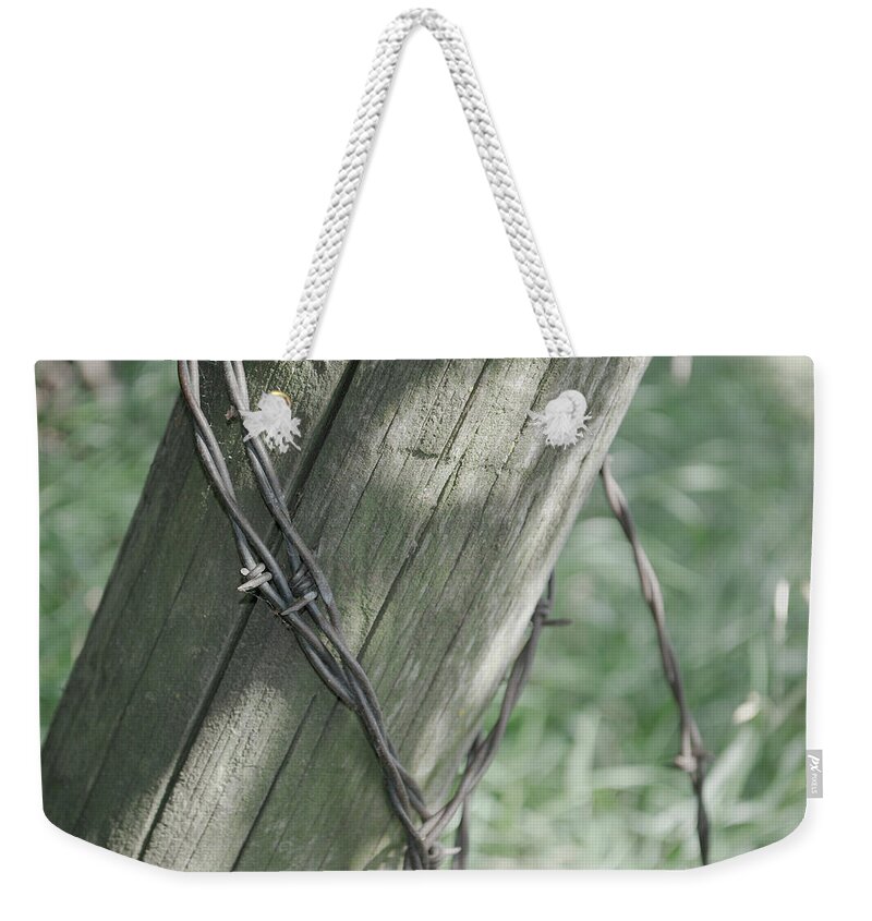 Barbwire Weekender Tote Bag featuring the photograph Barbwire Shadow by Troy Stapek