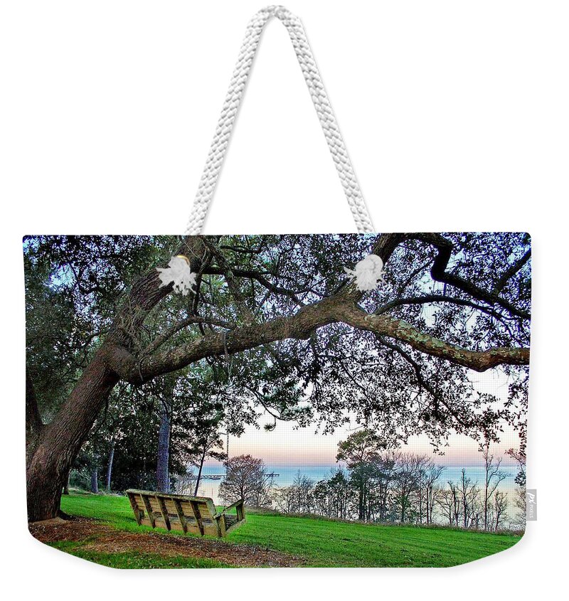 Fairhope Weekender Tote Bag featuring the photograph Bayview Swing Under the Tree by Michael Thomas