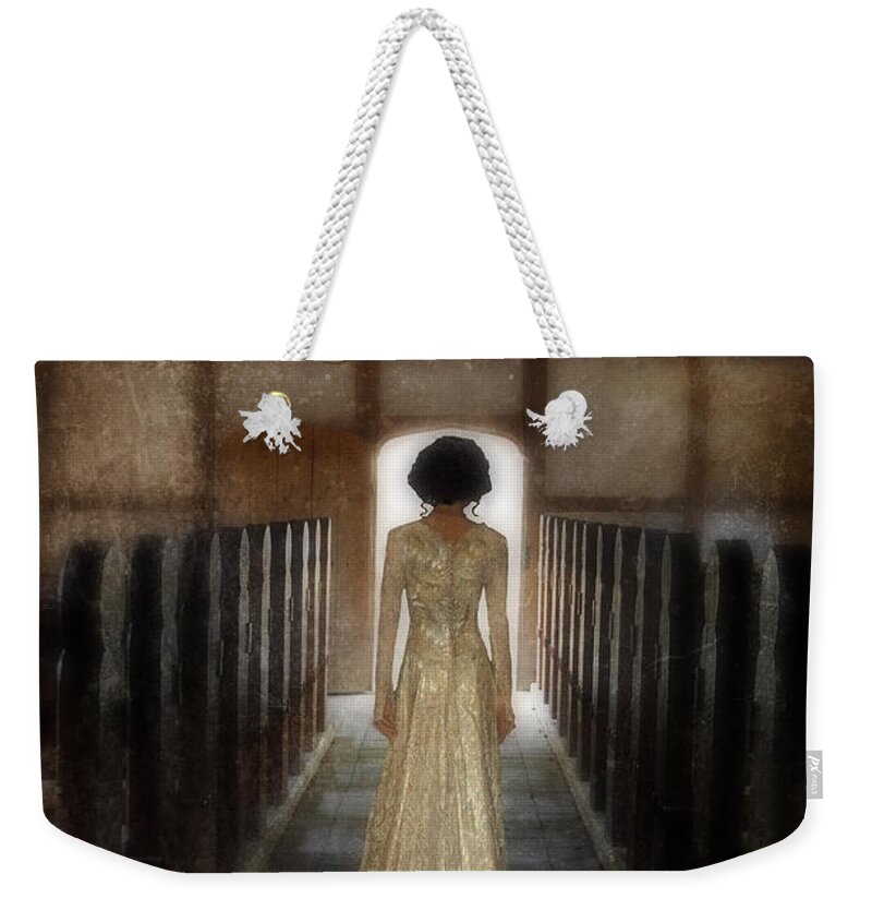 Woman Weekender Tote Bag featuring the photograph Beautiful Woman in Lace Gown in an old Rural Chapel by Jill Battaglia