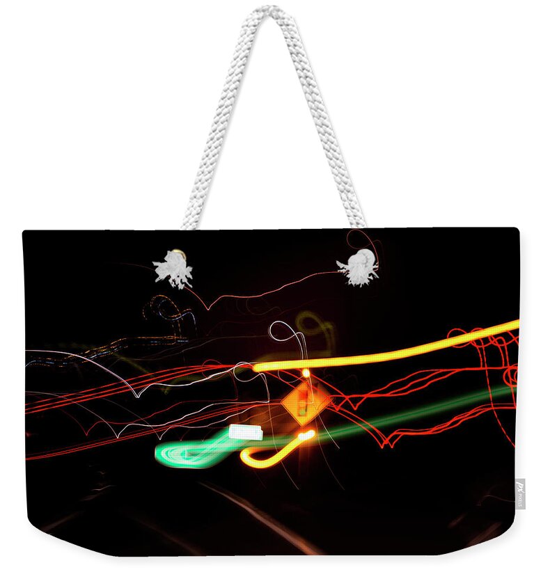 Abstract Weekender Tote Bag featuring the photograph Behind The Lights by Greg and Chrystal Mimbs