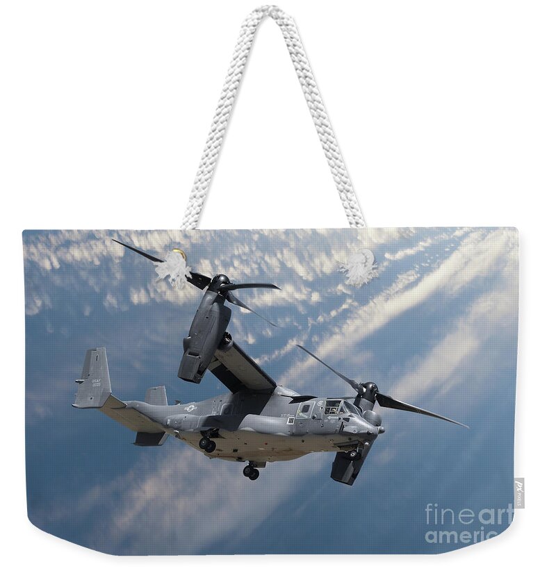 Osprey Weekender Tote Bag featuring the photograph Bell Boeing Osprey V-22 helicopter close up view flying by Simon Bratt