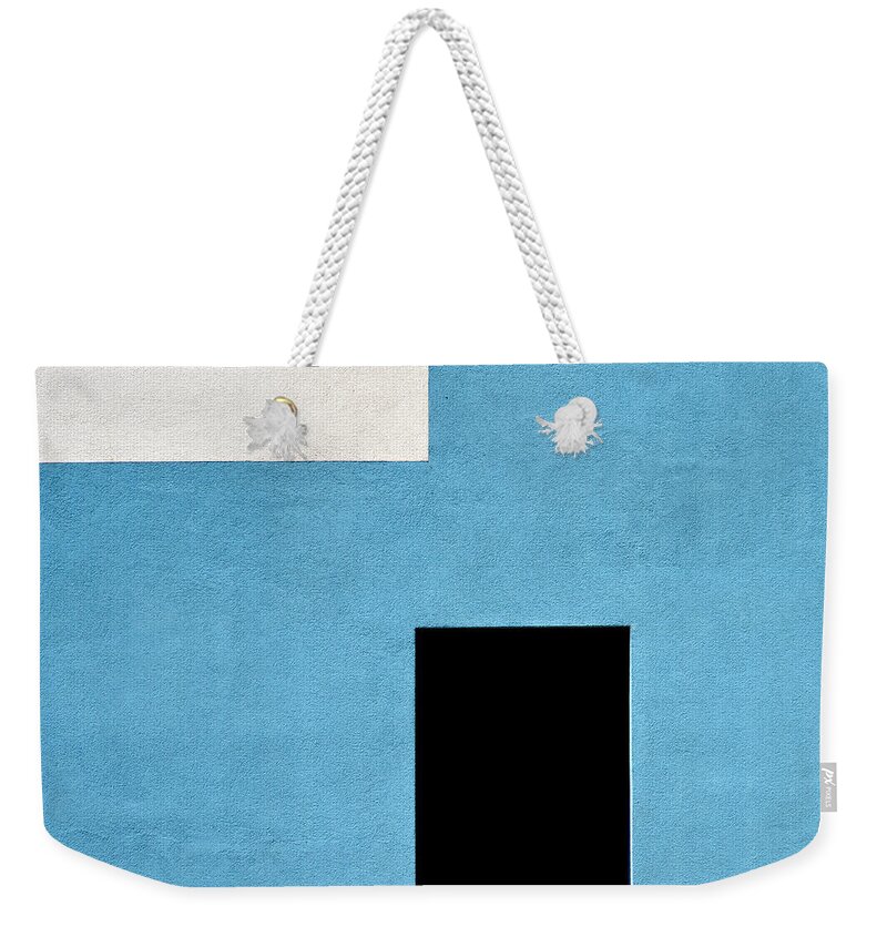 Urban Weekender Tote Bag featuring the photograph Black and White on Blue by Stuart Allen