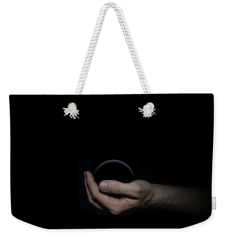 Black Weekender Tote Bag featuring the digital art Black Sphere in Hand by Pelo Blanco Photo