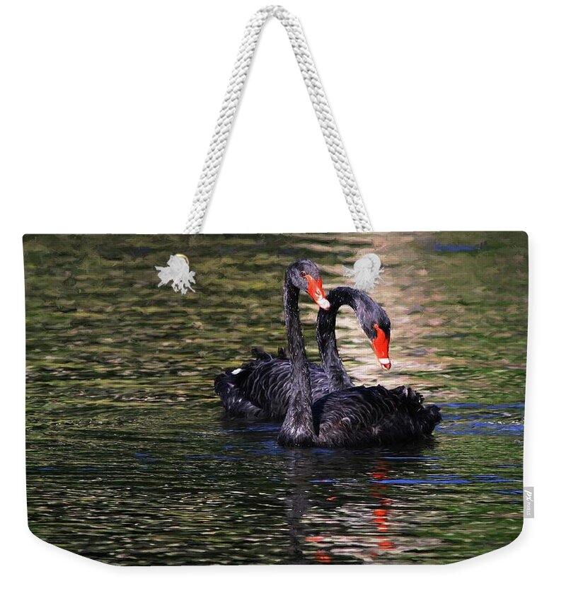 Black Swan Weekender Tote Bag featuring the photograph Black Swans II by Carol Montoya