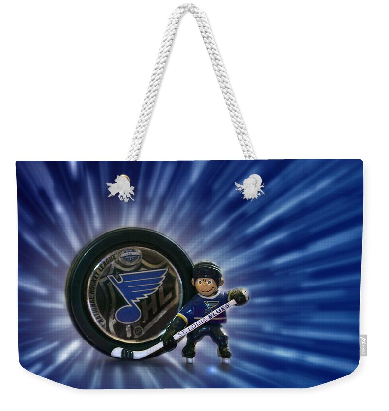 Nhl Weekender Tote Bag featuring the photograph Bleed Blue by Evelina Kremsdorf