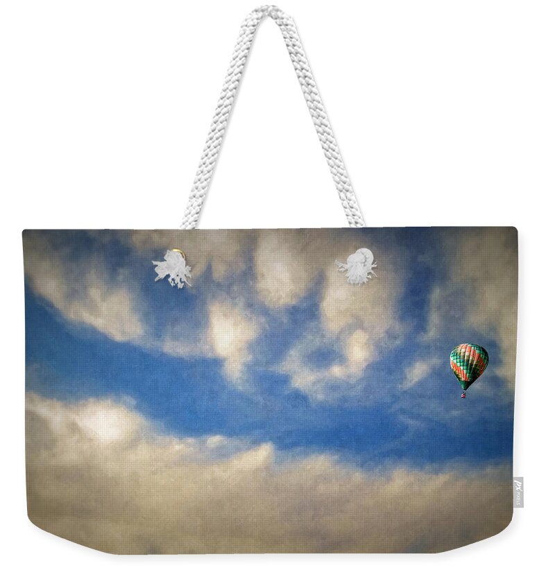 Blown Away Weekender Tote Bag featuring the photograph Blown Into A Soft Sky by Glenn McCarthy Art and Photography