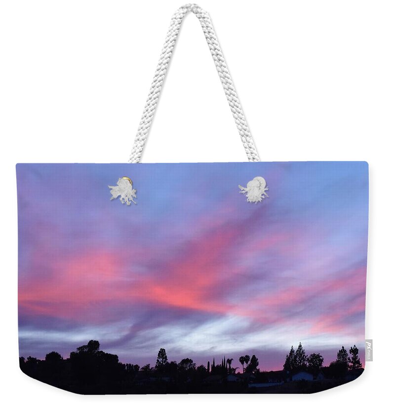 Linda Brody Weekender Tote Bag featuring the photograph Blue and Pink Clouds VII by Linda Brody