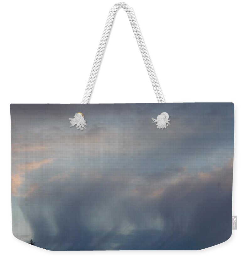 Nature Weekender Tote Bag featuring the photograph Blue Clouded Sunset - Vertical by Gallery Of Hope 