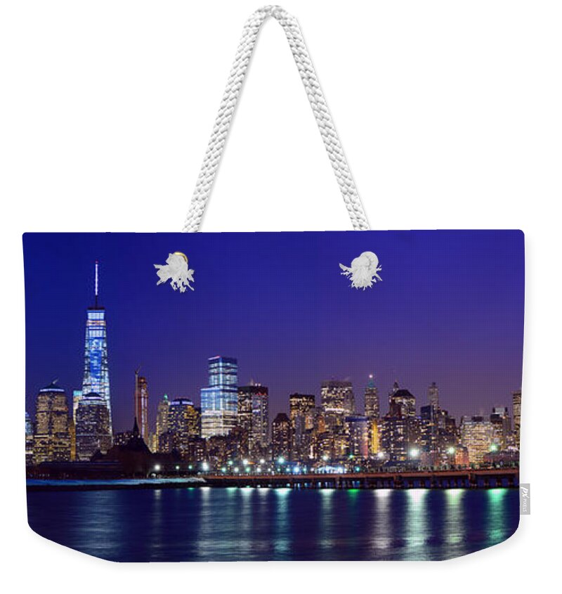 Blue Hour Panorama World Trade Center Weekender Tote Bag featuring the photograph Blue Hour Panorama New York World Trade Center with Freedom Tower from Liberty State Park by Raymond Salani III