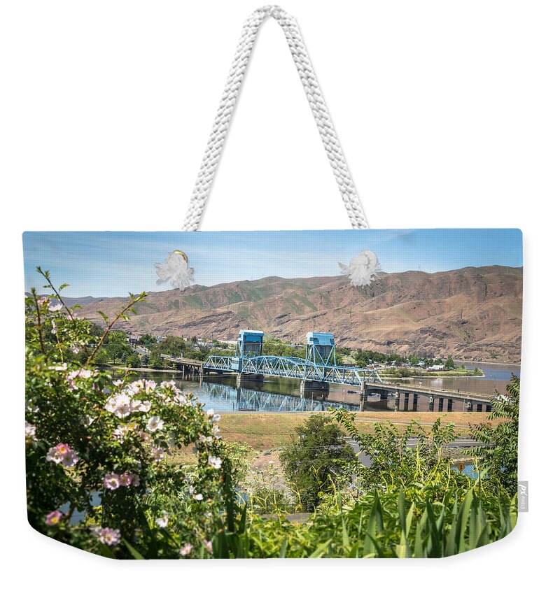 Lewiston Idaho Clarkston Washington Id Wa Lewis Clark Lc Valley Snake River Confluence Blue Bridge Daytime Pink Rose Bush Iris Green Blue Outdoors Scenic Interstate View Weekender Tote Bag featuring the photograph Blue in the Daytime by Brad Stinson