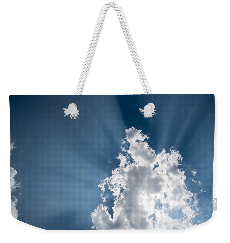Atmosphere Weekender Tote Bag featuring the photograph Blue sky with white clouds and sun rays by Michalakis Ppalis